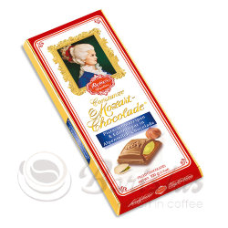 Reber Mozart 100г плитка молочного шоколада с ореховым пралине и фисташковым марципаном